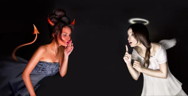 Portrait of angel and devil girls and copyspace between them. — Stock Photo, Image