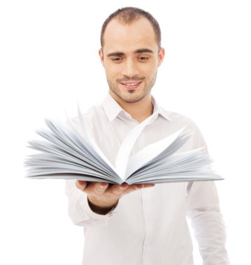 Adult man holding an opened book and reading. Self education of clipart