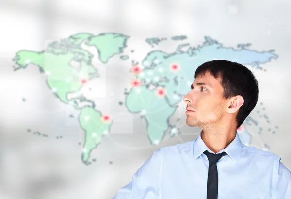 A business man is using the internet. A map of the Earth with gl — Stock Photo, Image
