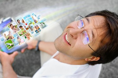 Man holding tablet computer and using social media. Always stay clipart