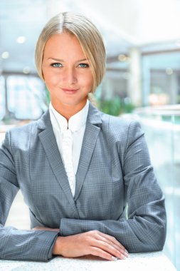 Portrait of confident business woman who is a bank worker or ins clipart
