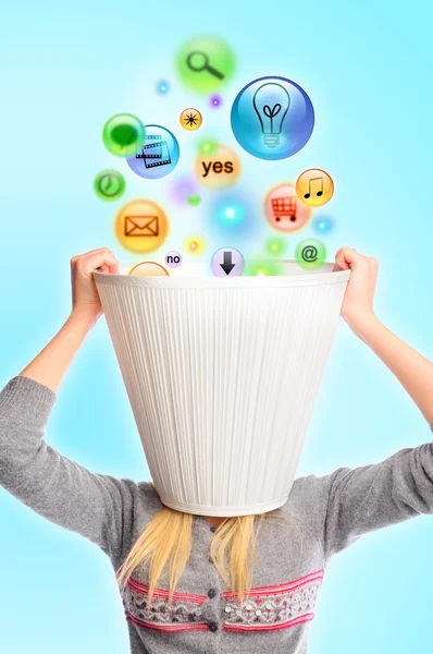 Young woman with lampshade on her head and icons falling inside. — Stock Photo, Image