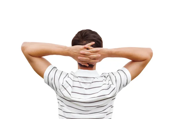 Young man standing against white background. Back view — Stock Photo, Image
