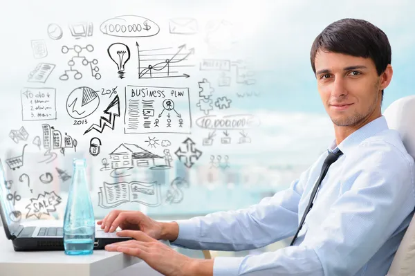 Adult business man sitting at his office and planning his busine — Stock Photo, Image