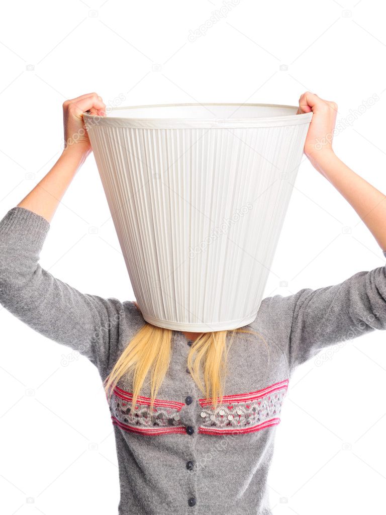Young woman wearing lampshade on her head. Young head is a place