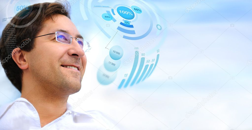 Adult handsome man working with virtual interface and smiling