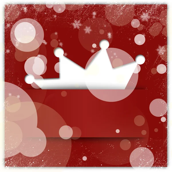 Красный рождественский фон с аппликацией короны и снежинкой — стоковое фото