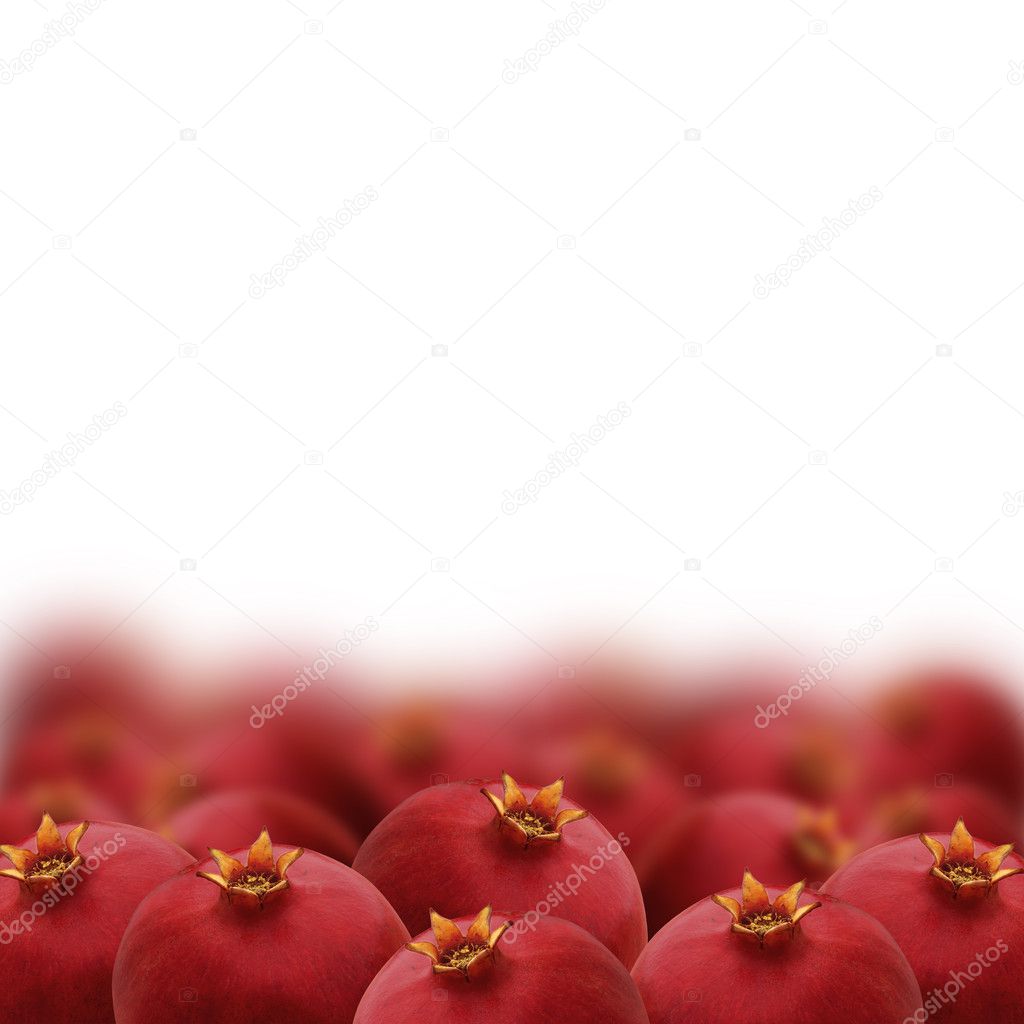 Bright red pomegranates isolated on white background