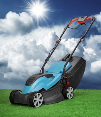 Lawnmower against blue sky and cumulus clipart