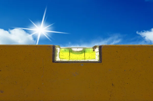 Detail of spirit level with blue sky light on background — Stock Photo, Image