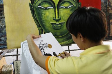 Tayland, bangkok, yerel bir pazarda bir havlu dekorasyon Tay street ressam