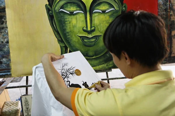 stock image Thailand, Bangkok, a Thai street painter decorating a towel in a local market