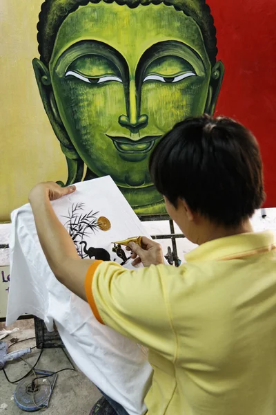 stock image Thailand, Bangkok, a Thai street painter decorating a towel in a local market