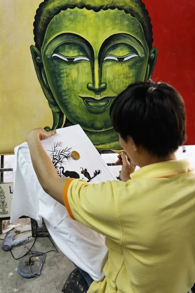 stock image Thailand, Bangkok, a Thai street painter decorating a towel in a local market