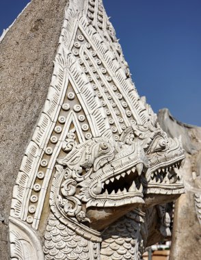 Thailand, Lampang Province, Pratartlampangluang Temple, religious statue at the entrance of the Buddhist temple clipart