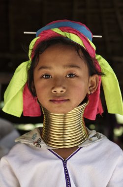 Thailand, Chiang Mai, Karen Long Neck hill tribe village (Kayan Lahwi), Long Neck young girl in traditional costumes. Women put brass rings on their neck when they are 5 or 6 years old and increase th clipart
