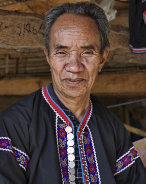 Thailand, Chiang Mai, Karen Long Neck hill tribe village (Kayan Lahwi), Karen man in traditional costumes clipart