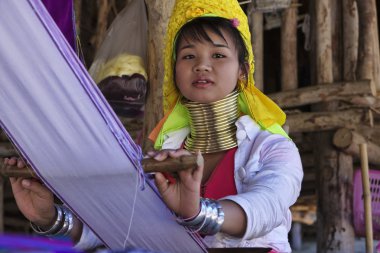 Thailand, Chiang Mai, Karen Long Neck hill tribe village (Baan Tong Lhoung), Long Neck woman in traditional costumes. Women put brass rings on their neck when they are 5 or 6 years old and increase th clipart