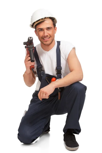 Portrait of happy young handyman with tool — Stock Photo, Image