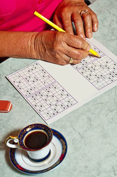 stock image Pensioner with sudoku