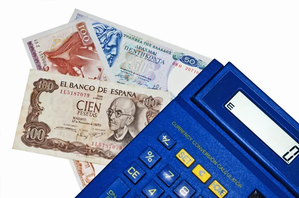 Euro-crisis, calculadora con billetes Peseta y Drachm —  Fotos de Stock