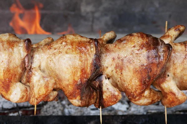Three chicken carcasses and chicken on the grill. — Stock Photo, Image