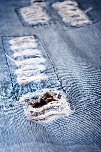 Velho jeans azul rasgado — Fotografia de Stock