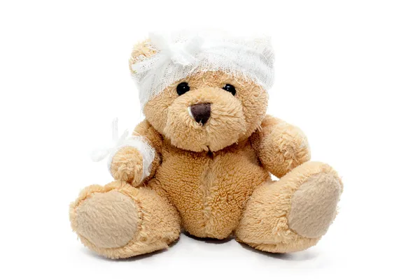 Teddy bear with bandaged head — Stock Photo, Image