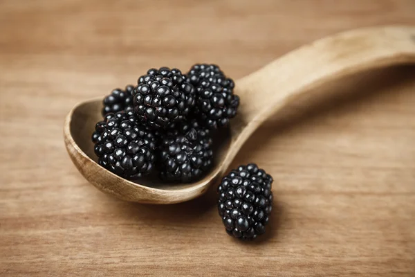 Blackberries in spoon — Stock Photo, Image