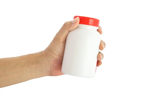 Mão dar pedaço de etiqueta vermelha garrafa médica no fundo branco . — Fotografia de Stock