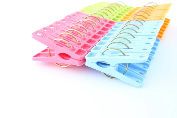 Row of peg package focus near on white background. — Stock Photo, Image