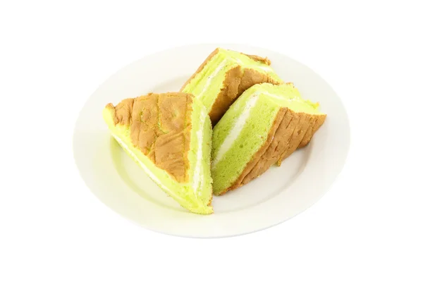 Σφουγγάρι πιάτο κρέμα κέικ σε άσπρο φόντο. — Φωτογραφία Αρχείου