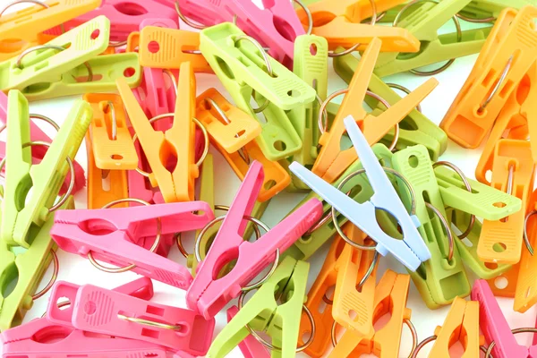 Pile of multiple color pegs fucos blue one. — Stock Photo, Image