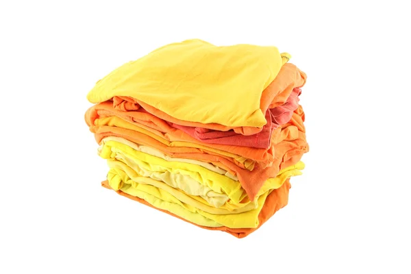 Stapel von gelben und orangefarbenen Tüchern auf weißem Hintergrund. — Stockfoto