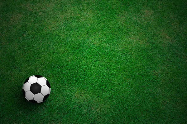 Voetbal op groen gras — Stockfoto