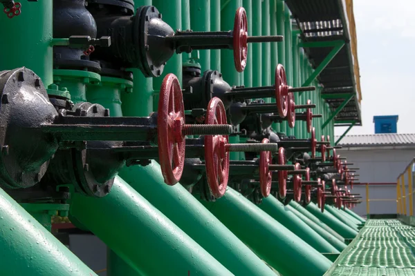 stock image Red handle gate valve with steel pipe on gas compressor station