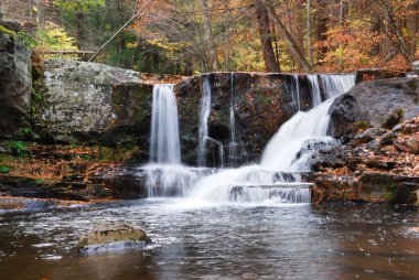 Autumn Waterfall in mountain clipart