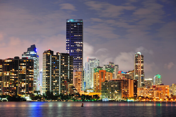 Miami urban architecture closeup over sea at night.