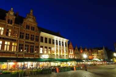 Markt (Market Square) of Bruges at dusk clipart