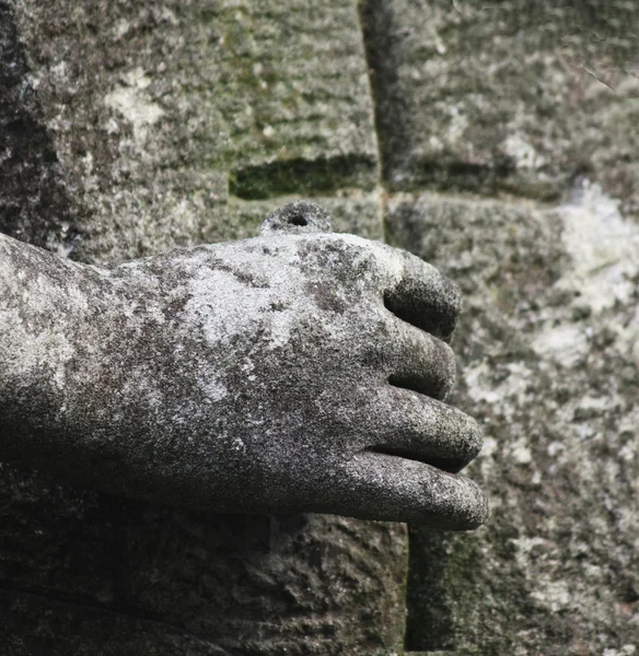 stock image Cross in his hand (part of the architectural composition)