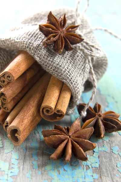 Cinnamon and anise in a small burlap sack Stock Photo