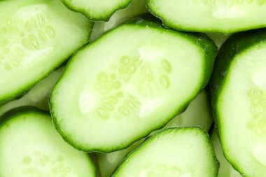 Fresh sliced cucumbers background clipart