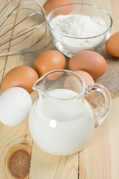 Basic ingredients for dough. Milk, eggs and flour. — Stock Photo, Image