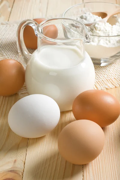 Basic ingredients for dough. Milk, eggs and flour. — Stock Photo, Image