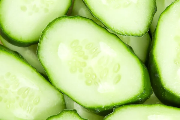 Fresh sliced cucumbers background — Stock Photo, Image