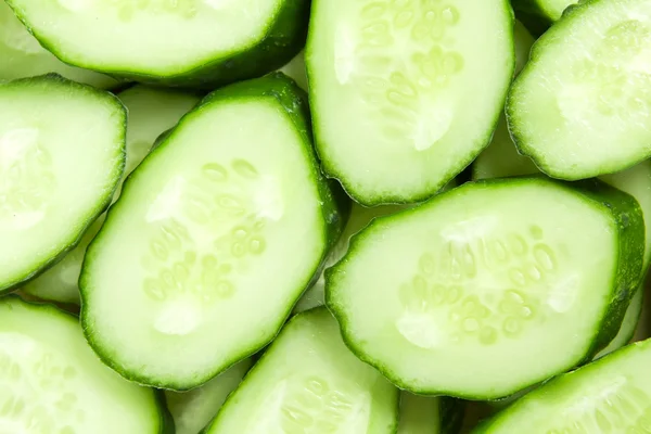 Fresh sliced cucumbers background — Stock Photo, Image