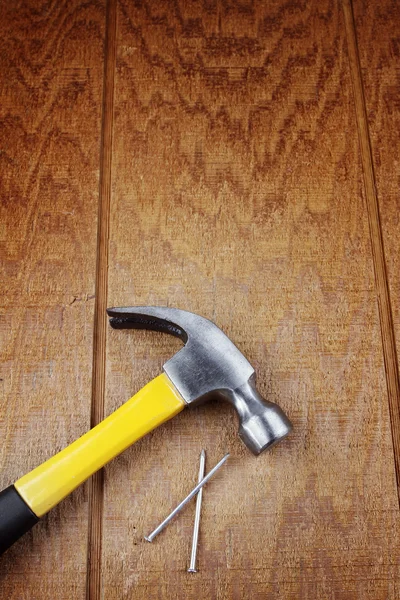 Hammer and nails on wood — Stock Photo, Image
