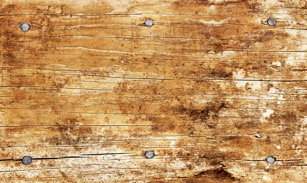Six nails in old wooden surface — Stock Photo, Image