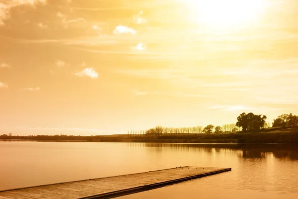 stock image Boat jetty on calm lake, New Zealand