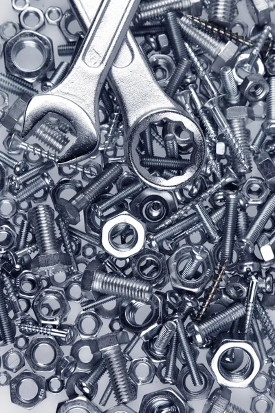 Two spanners on nuts and bolts — Stock Photo, Image